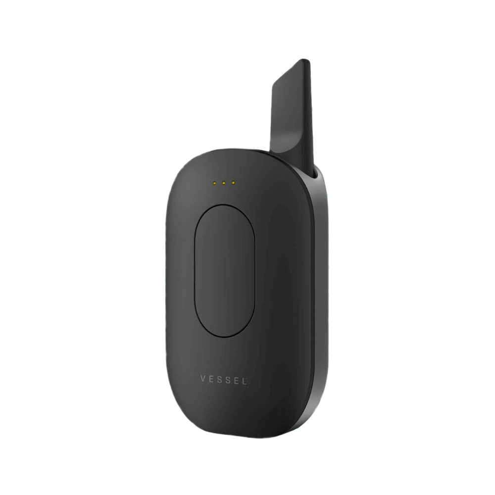 Vessel Compass vape device in gunmetal black with charging dock and LED indicators