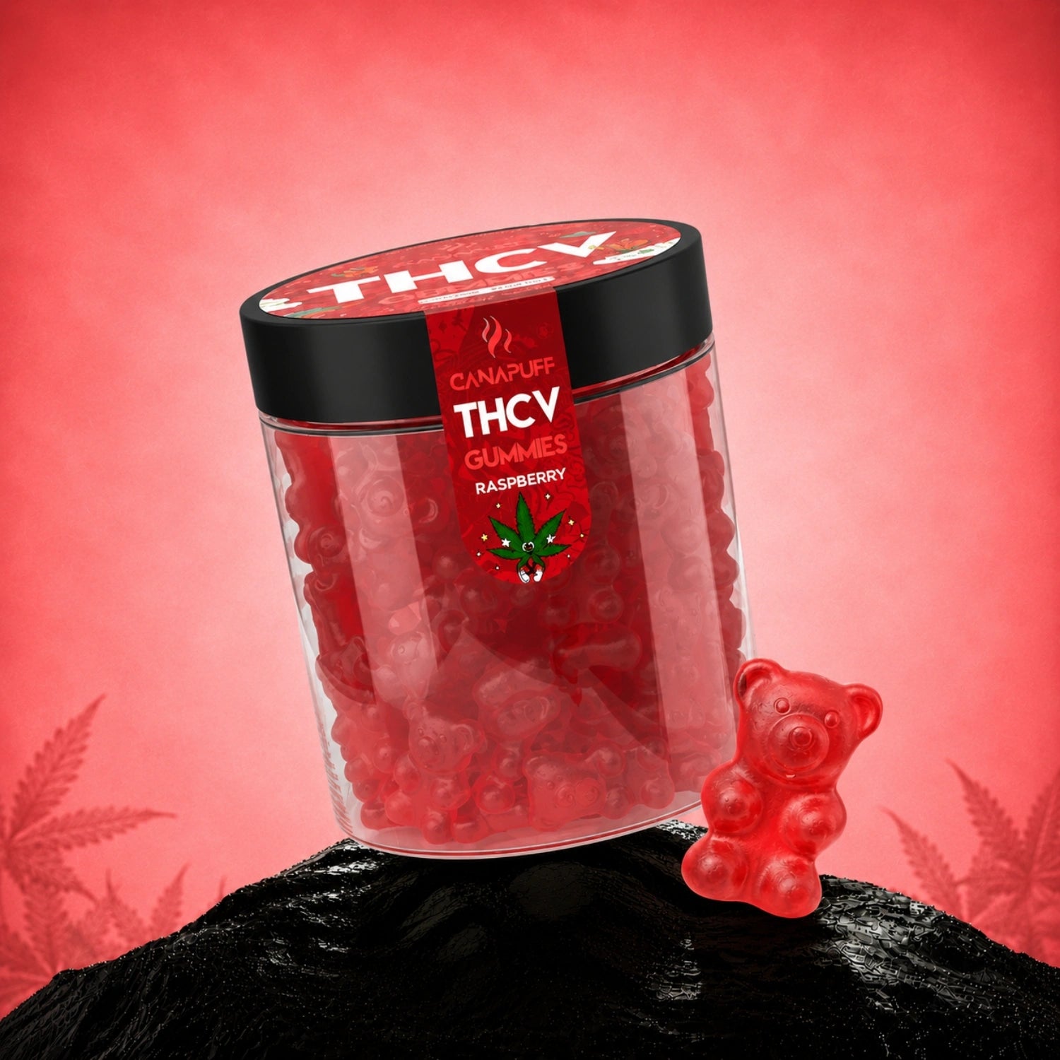 Canapuff THCv Gummies Raspberry in clear jar with black lid, red gummies and bear-shaped gummy beside on black rock